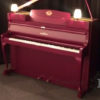 Schimmel Klavier 108 in Burgunderrot - elegantes Markenklavier im Chippendale-Stil